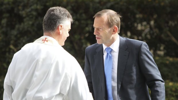 Prime Minister Tony Abbott arrives at Paul Ramsay's funeral