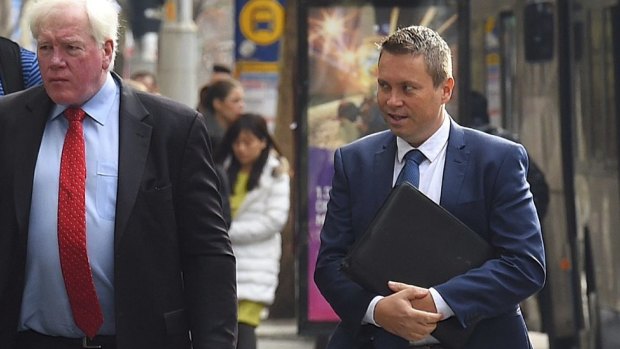 Anthony Andjic (right) talks with his lawyer as they arrive at the
Independent Commission Against Corruption