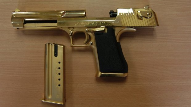 A gold-plated .357 calibre pistol, seized by police, which led to the name "Golden Gun" syndicate.