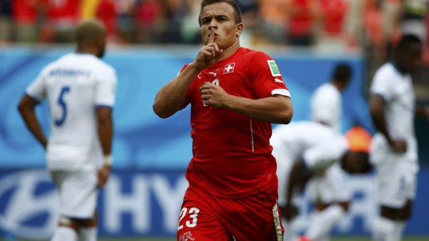 Make mine a treble: Switzerland's Xherdan Shaqiri celebrates his first goal.