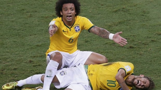 Panic: Marcelo gestures over his injured teammate Neymar.