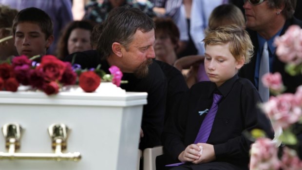 Jordan's father John and the brother he saved, Blake, at the teenager's funeral.