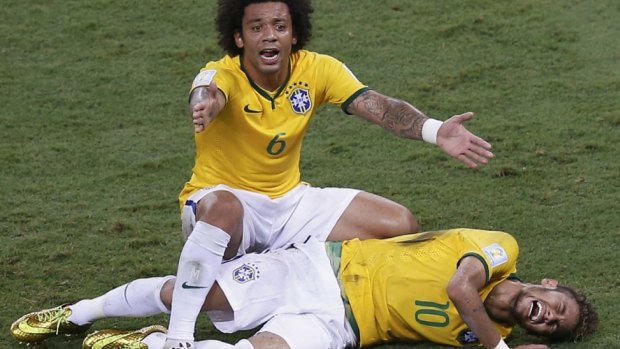 Ruled out: Marcelo gestures over his injured teammate Neymar.