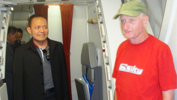 Peter Walbran, right, arrives in Indonesia in 2011 to face child rape charges.