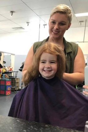 Canberra hairdresser Nicole McDonald with Ava Wright, three. Nicole is giving free hair cuts to all red heads on March 3.