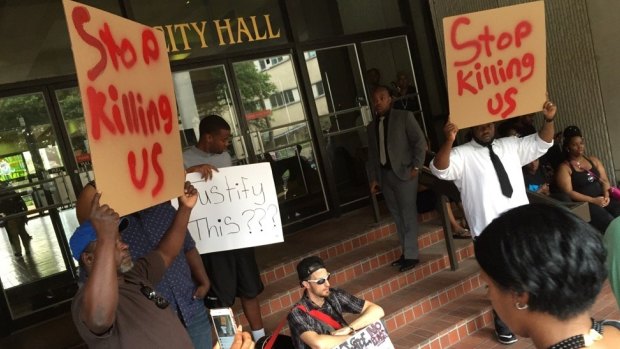 Protesters gather at City Hall in Baton Rouge over the shooting of Alton Sterling on Wednesday.