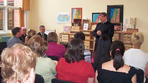 Father John Walshe addressing parents at St Patrick's school in Mentone in 2010. 