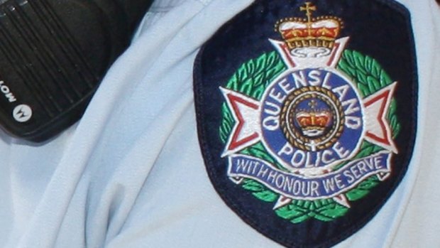 A policewoman was hit over the head with a bottle at an out-of-control party on the Gold Coast. 