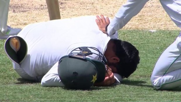 Azhar Ali lays stunned after he was struck by a Wade shot.