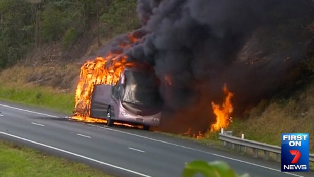 A school bus burns in the northbound lane of the Bruce Highway near Sippy Downs, north of Brisbane.