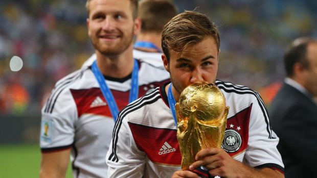 Bright future: Mario Goetze of Germany kisses the World Cup.