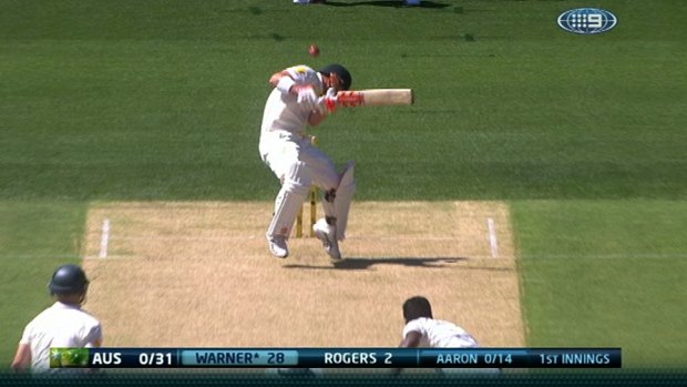 Australia's opening batsman David Warner ducks beneath the first bouncer of the Test series against India.