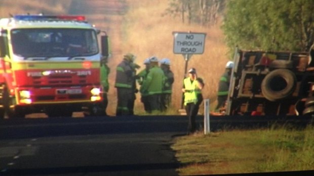 A man died after a truck rolled onto his car at Peak Crossing, south-west of Ipswich.