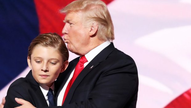 Donald Trump embraces his son Barron Trump after he delivered his speech on the fourth day of the Republican National Convention in July 2016.