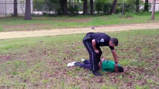 North Charleston police officer Michael Slager is seen standing over 50-year-old Walter Scott after allegedly shooting him in the back.