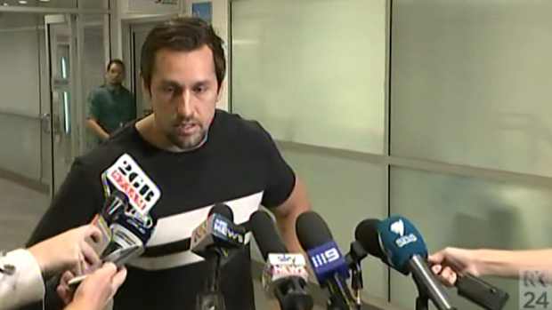 Waiting game: Mitchell Pearce talking to the media at Sydney Airport on Sunday.