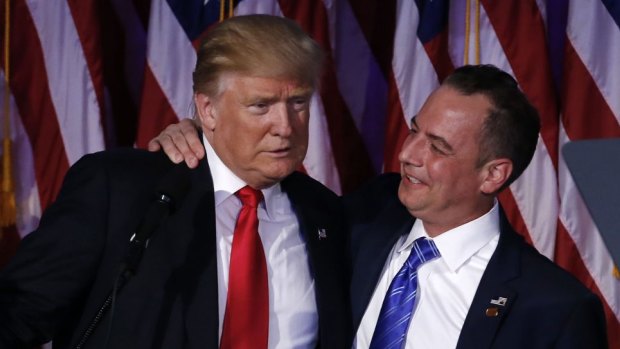 US President-elect Donald Trump, left, embraces Reince Priebus, chairman of the Republican National Committee.