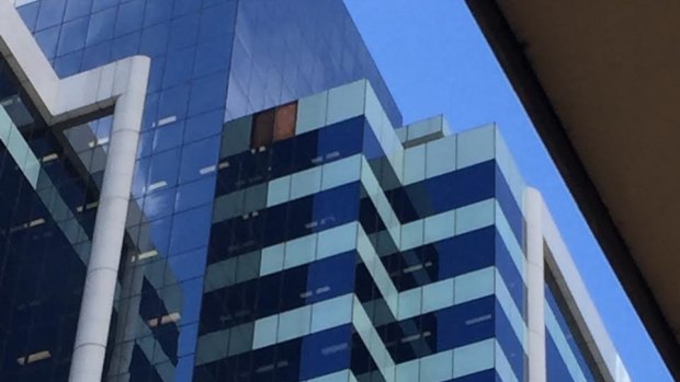 A panel fell from the Allianz Centre in Sydney's CBD, witnesses say.