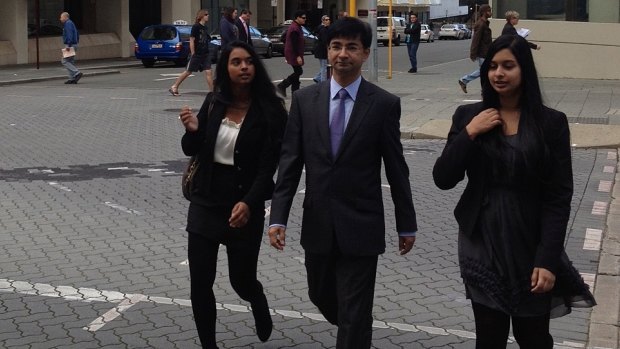 Lloyd Rayney flanked by daughters Caitlyn and Sarah in Perth.