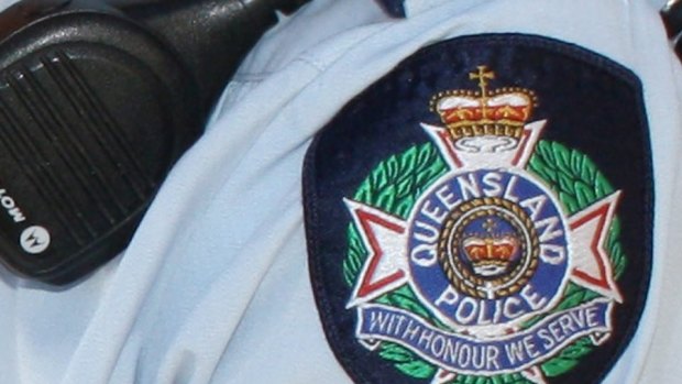 A police officer was punched and bitten during an incident in regional Queensland.