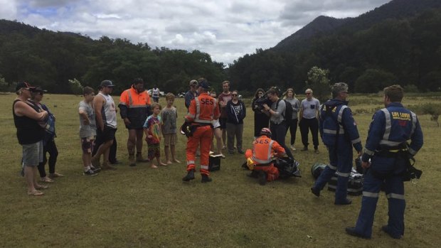 SES and Westpac Lifesaver Helicopter members meet with stranded campers in the Deua National Park.