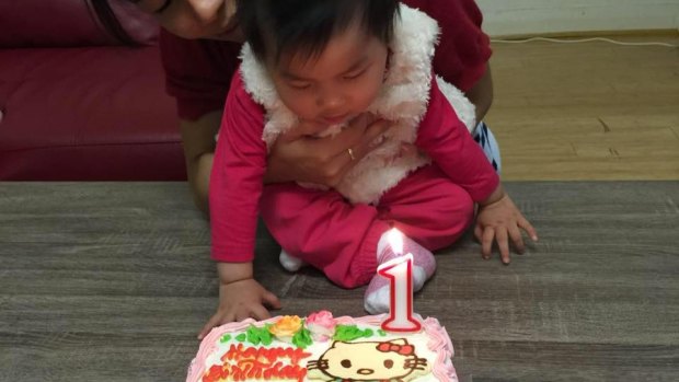The body of baby Sienna, pictured on her first birthday, was found near her mother's. 