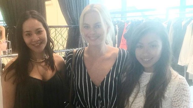 Catlina Vera Vera (left) and Taylor Cichacz (right) with actress Margot Robbie at Rebel Muse in Braddon. 