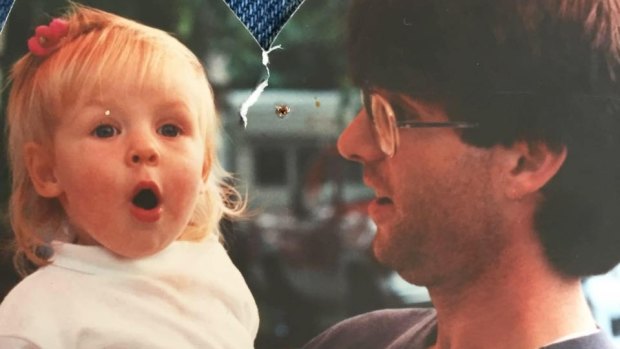 Molly Parks as a toddler with her father, Tom.