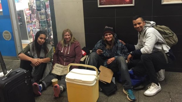 Siham and Mirwan Carollisen (far right and far left) helping the homeless in Northbridge earlier this year. 