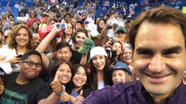 Federer took selfies with fans following his training session.