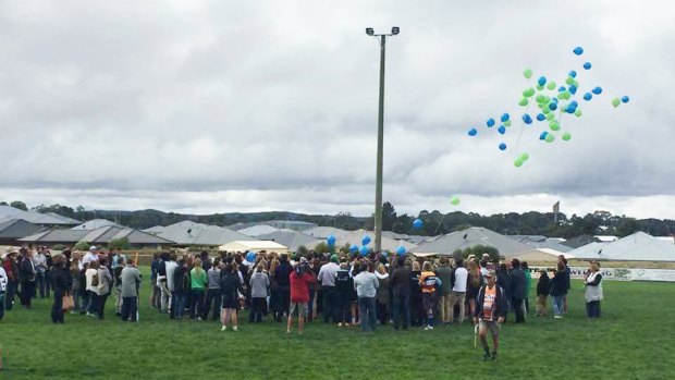 Friends gathered to release balloons for the teen, who was a student at Orange High School.