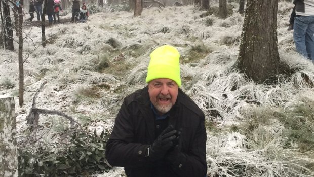 Ipswich councillor Paul Tully enjoys the snow at Mount Mackenzie.