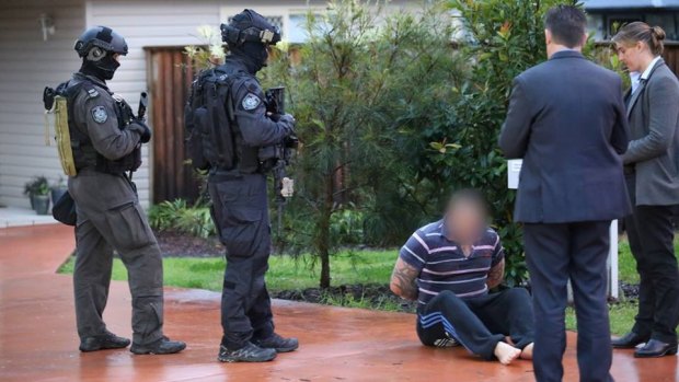 Police arrest the Rebels president at his home in Kingswood, in Sydney's west, on Friday.