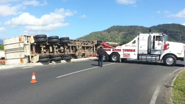Watermelons spill down a grassy verge after a truck crashed north of Cairns.