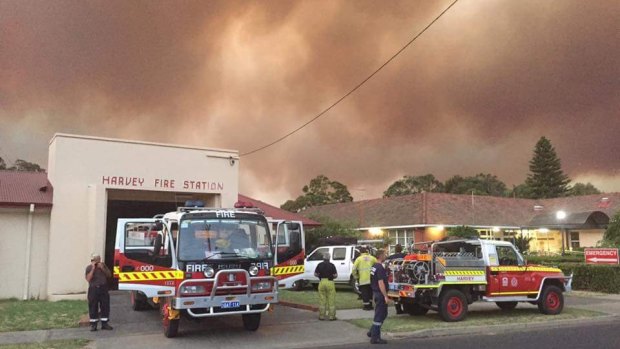 Weary firefighters at Harvey Fire Station in Western Australia on Monday. 