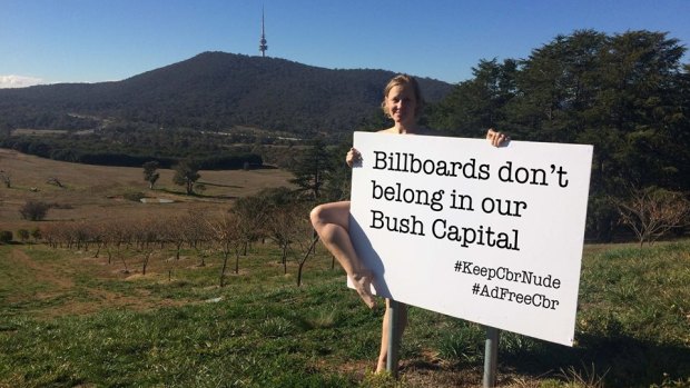 Deb Cleland poses for a social-media campaign aiming to keep Canberra "nude" - billboard ad-free.
