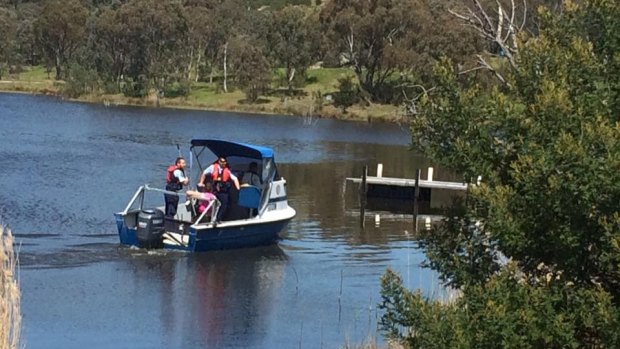 A woman in a canoe rescued a man at Googong Dam on Thursday.
