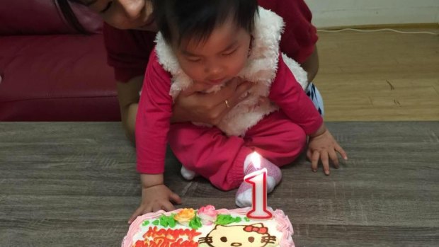 The body of baby Sienna, pictured on her first birthday, was found near her mother's. 