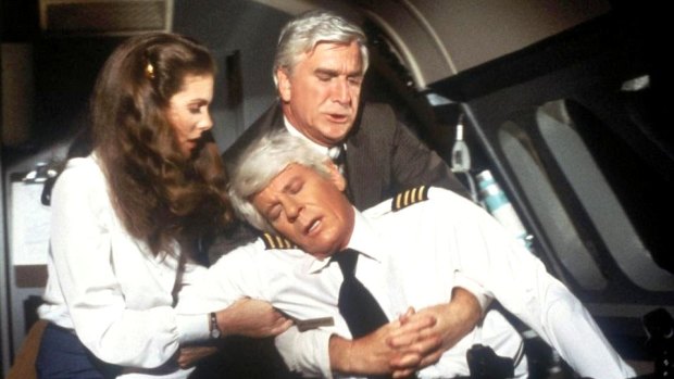 Passengers were lucky Dr. Rumack (Leslie Nielsen, rear) was on board in 1980 comedy film Flying High.