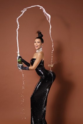 The champagne flows for Kim Kardashian in one of the shots by Jean-Paul Goude.