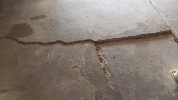 The earthquake caused significant cracks to the garage floor in Amy MacDonald's Chermside home.