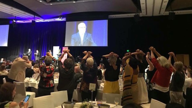 Human Rights Awards finalists joined together in silent protest as Attorney-General George Brandis spoke at the Westin Hotel ceremony.