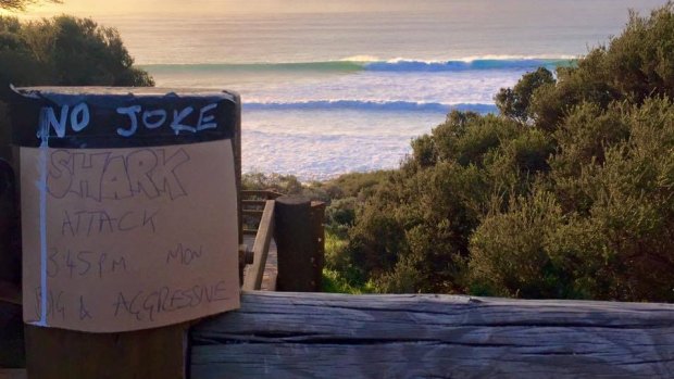 A homemade sign warning surfers of the shark attack on Monday at Indijup Beach, near Yallingup.