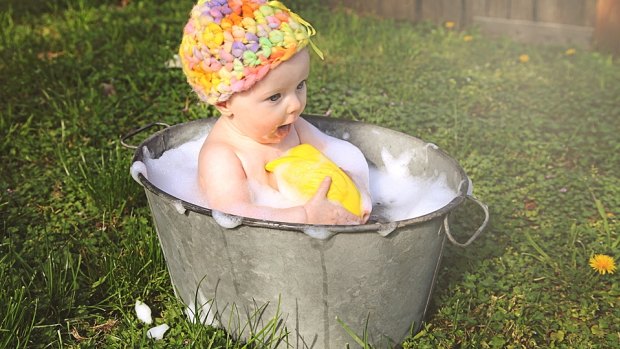 Belinda Garfath's daughter Ava enjoys her first summer outside in the bath. 