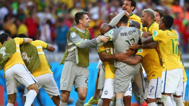 Jubilation: Brazil celebrate winning the penalty shoot out.