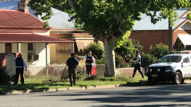 Police search a house in Gurwood Street, Wagga Wagga, where a 19-year-old man was arrested on Tuesday evening.