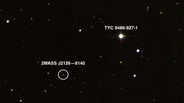 A photograph captures the planet 2MASS J2126-8140, in orbit around its host star TYC 9486-927-1.