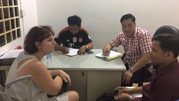 Australian nurse Tammy Davis-Charles is questioned by Cambodian police in November of last year.