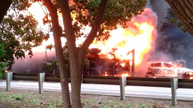 Fireball: The tanker lies on its side engulfed by flames.