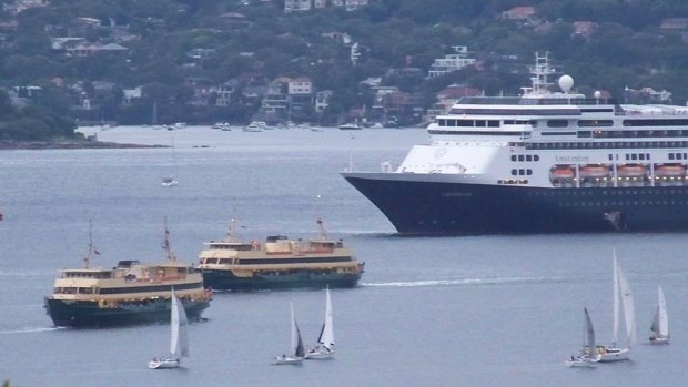Sydney ferries Freshwater and Collaroy slowed as they passed the stationary cruise ship.
